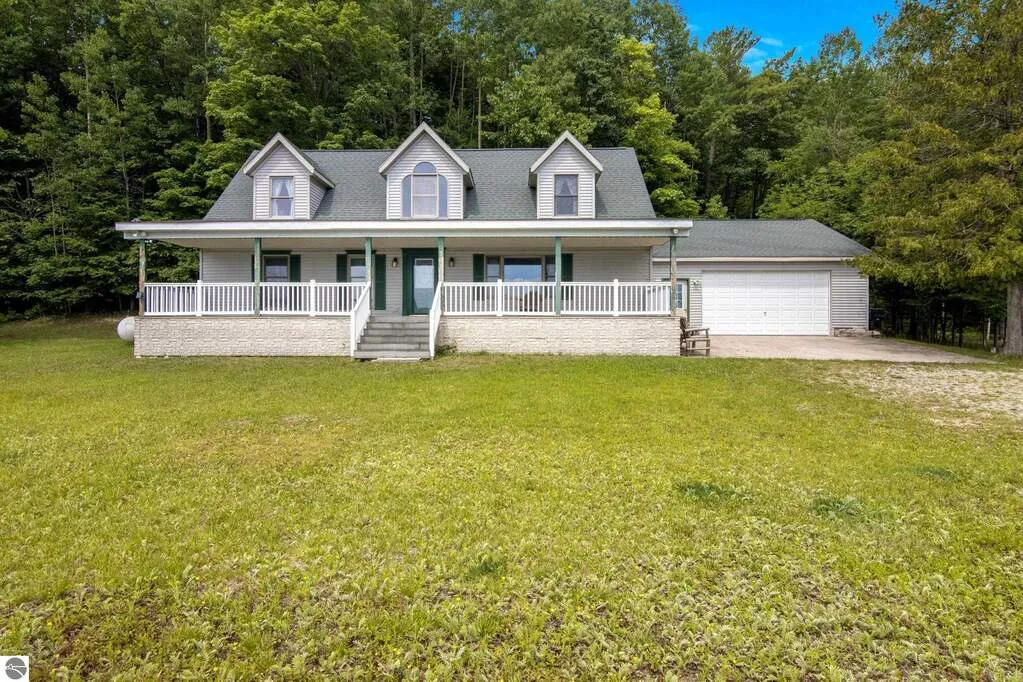The 4-bedroom Cape Cod home at 16043 Wagner Road, on 7 acres of Pearl Lake frontage